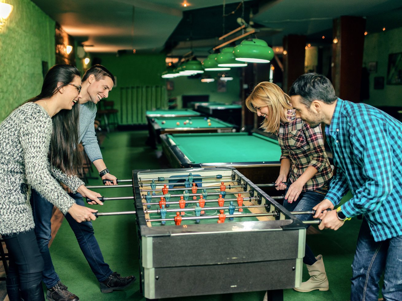 Freinds playing foosball